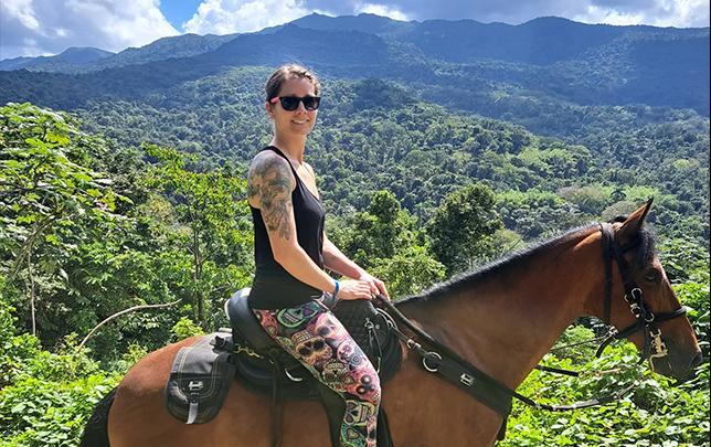 Rider on horseback at Rainforest River Ride Adventure in El Yunque National Rainforest, Rio Grande, Puerto Rico