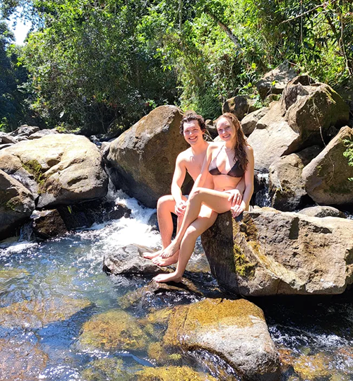 couple-posing-in-river-at-rainforest